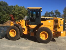 Commercial snow removal equipment, McLeod Landscaping, showcasing heavy machinery for snow management services.